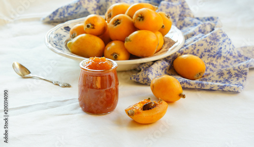 Konstfotografi homemade loquat jam on the white background, Contre-jour light