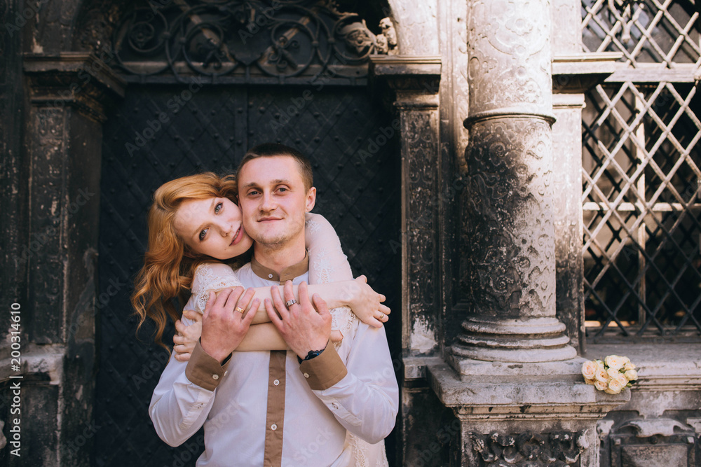 Obraz premium young and beautiful woman and man standing together outdoors