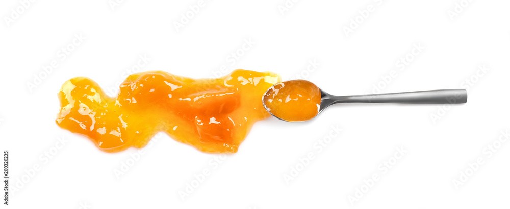 Fotografie Spoon with sweet jam on white background