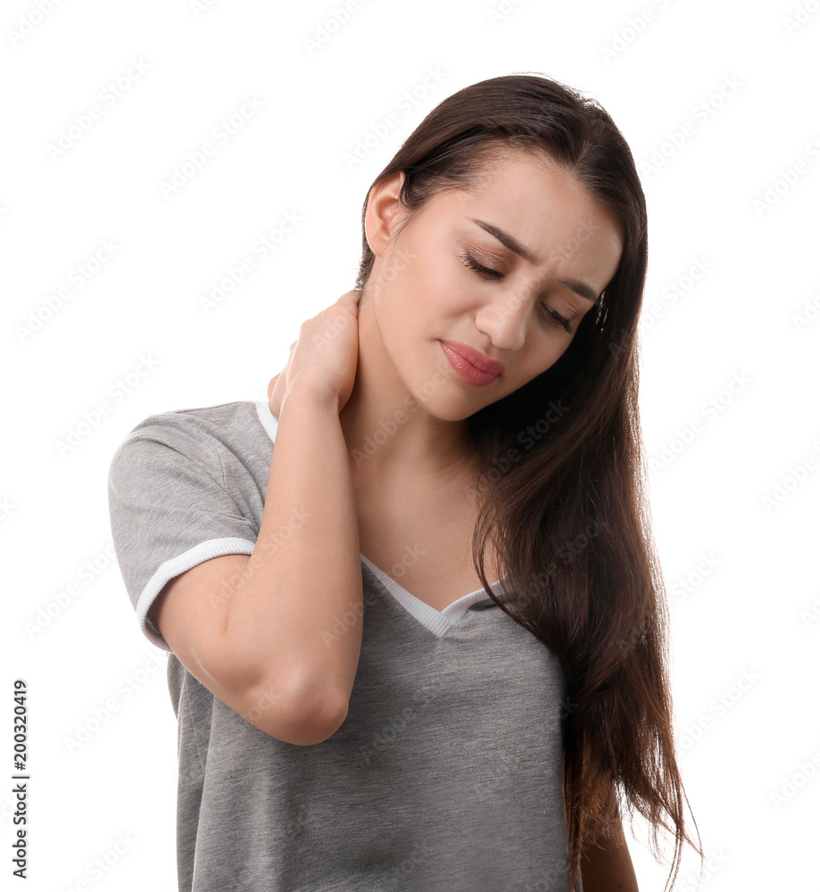 Young woman suffering from pain in neck on white background Young woman suffering from pain in neck on white background