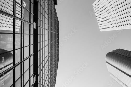 Bottom up view of Modern office building in Hong Kong with B&W color