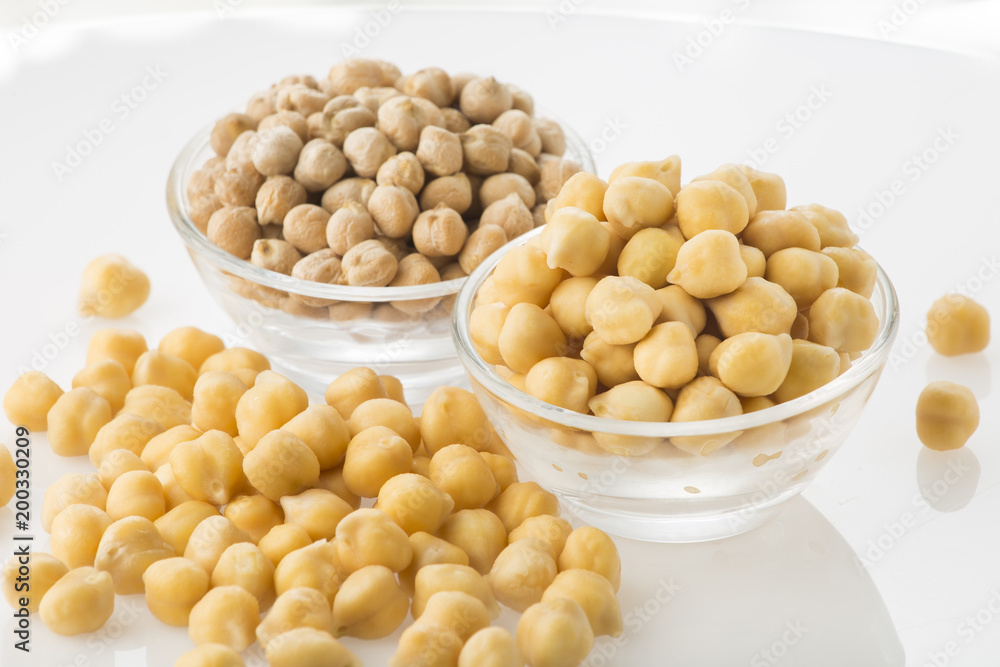 Chickpea grains (Cicer arietinum) in bowl isolated on white background Chickpea grains (Cicer arietinum) in bowl isolated on white background