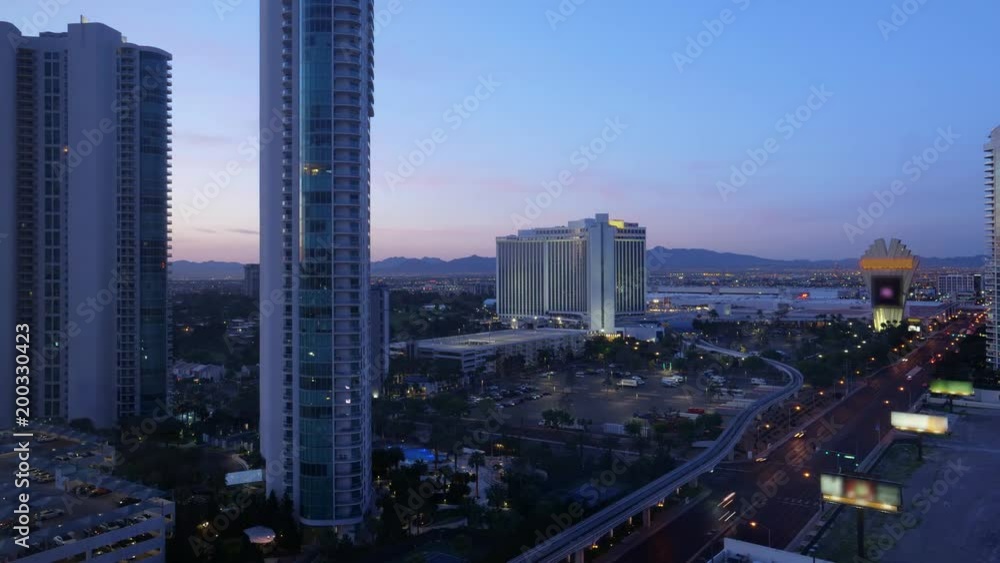 A night to day time lapse of the Las Vegas landscape. Hotels and residential buildings in the foreground.
A night to day time lapse of the Las Vegas landscape. Hotels and residential buildings in the foreground.
