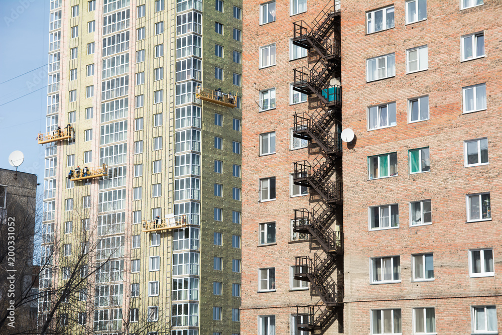 Fototapeta premium Exterior Work on Unfinished Apartment Block