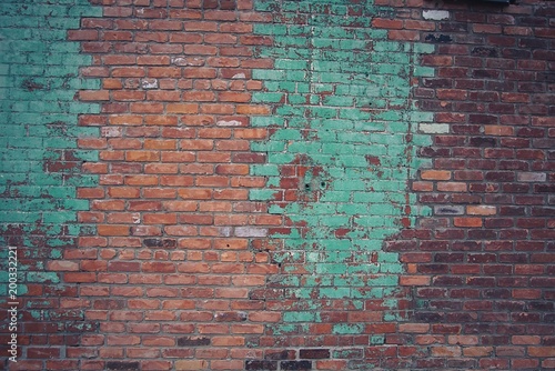 red brick wall with turquoise paint