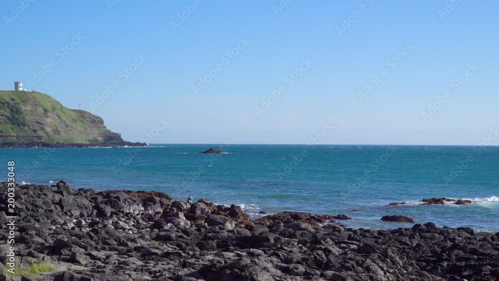 Landscape of the coastline of Olle trail No.12 between Suwolbong peak and Chaqwido port in Hangyeong-myeon, Jeju island, Korea. There is famous for its beautiful scenery and geological uniqueness. Landscape of the coastline of Olle trail No.12 between Suwolbong peak and Chaqwido port in Hangyeong-myeon, Jeju island, Korea. There is famous for its beautiful scenery and geological uniqueness.