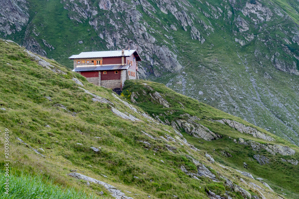 The Transfagarasan mountains and a cabin nearby them