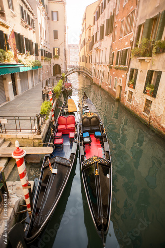 Canal with two gondolas in Venice, Italy.