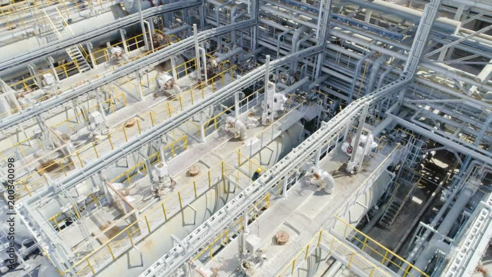 Worker Walks on Bridge Inspects Fuel Reservoirs Worker Walks on Bridge Inspects Fuel Reservoirs