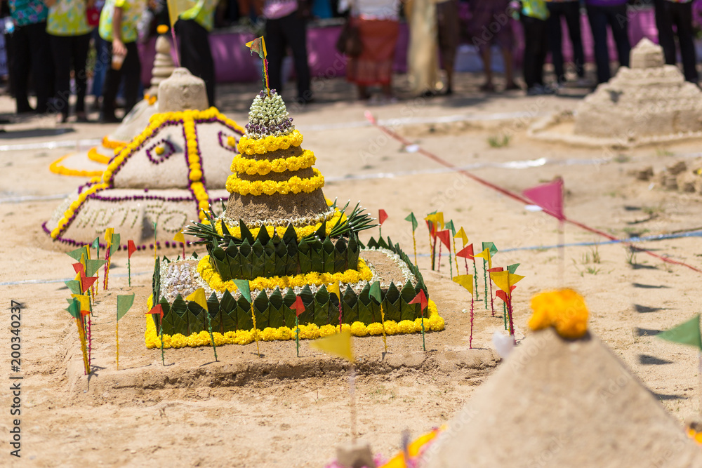 Thai people come to build the Sand Pagoda for return the sand to the temple on Songran festival at Ratchaburana temple in Phitsanulok Thailand.
