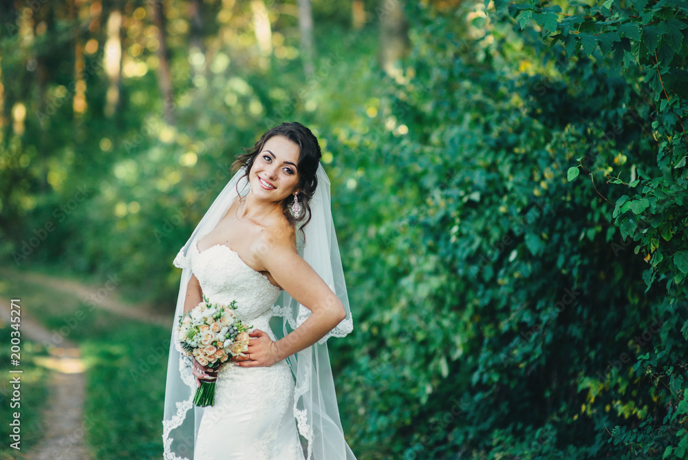 Beautiful bride outdoors in a forest