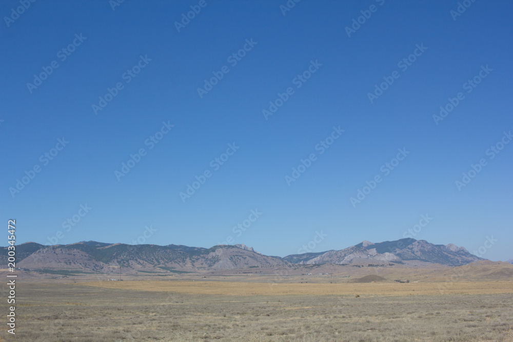 A view of the mountains and the deserted steppe in the summer.