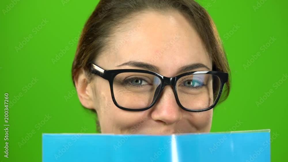 Girl is reading a book. Green screen. Close up Girl is reading a book. Green screen. Close up