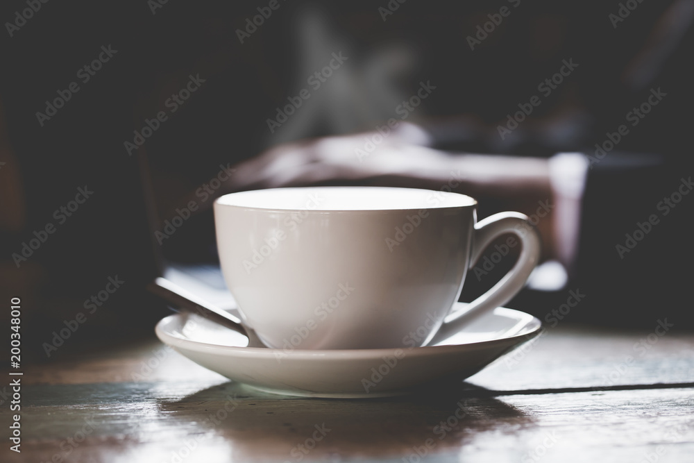 Hot black coffee on a natural background blurred Style dark tone Hot black coffee on a natural background blurred Style dark tone