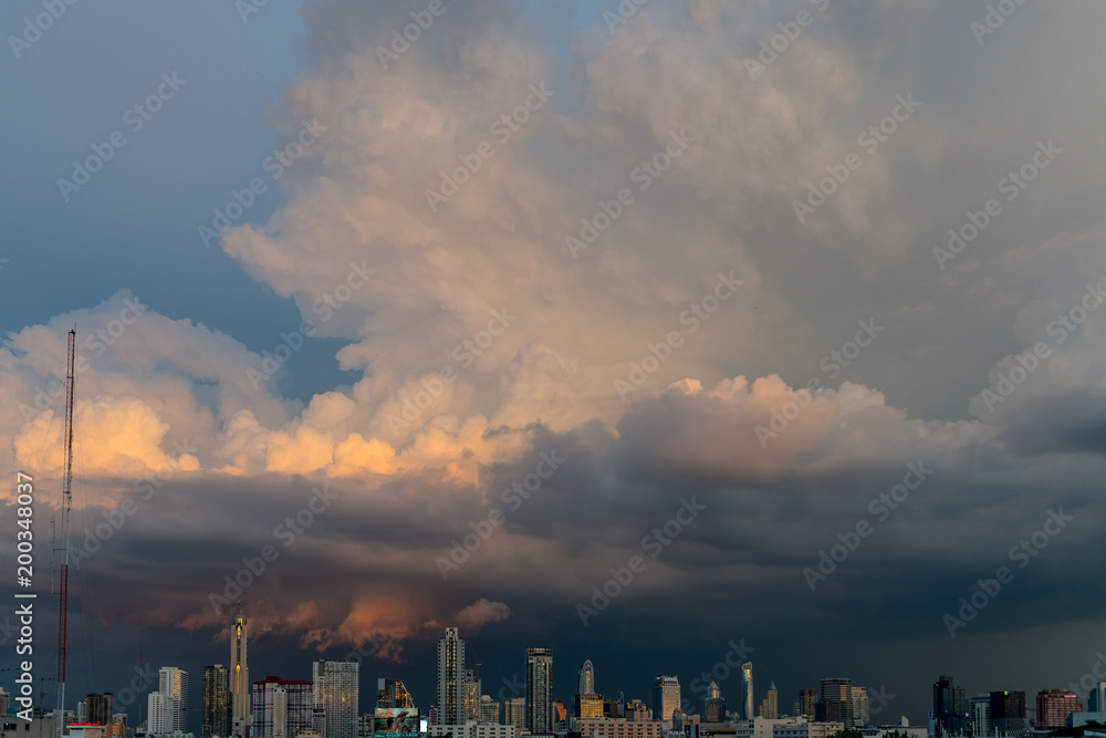 Fototapeta premium storm clouds above bangkok city with beautiful sunset light