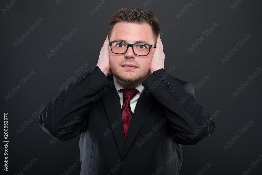 Business man making covering ears like deaf concept. Business man making covering ears like deaf concept.