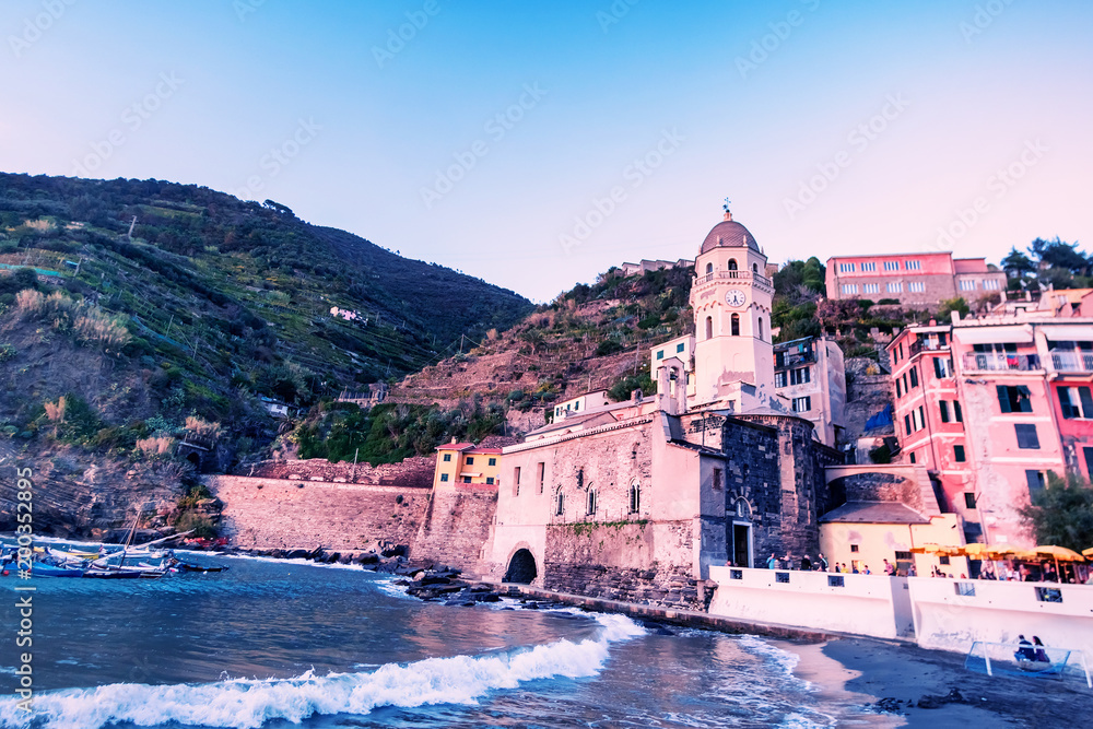 Scenic view of the  summer Vernazza - one of five famous villages of Cinque Terre National Park in Liguria, Italy, suspended between Ligurian sea and land on sheer cliffs