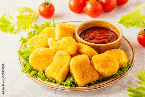 Chicken breast nuggets with sauces.