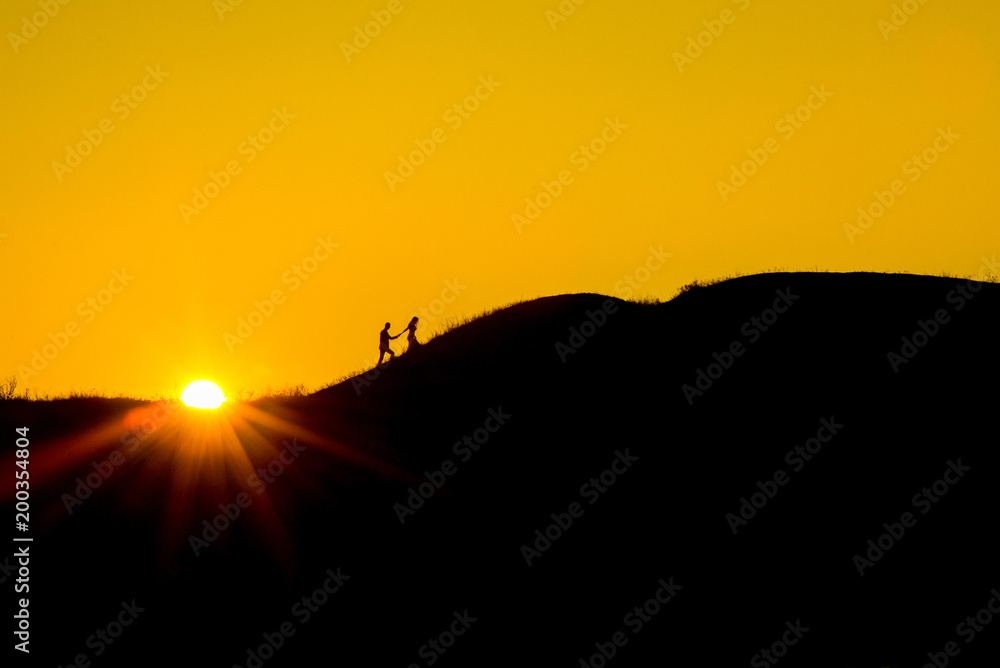 Romantic bride and groom watching sunset Romantic bride and groom watching sunset