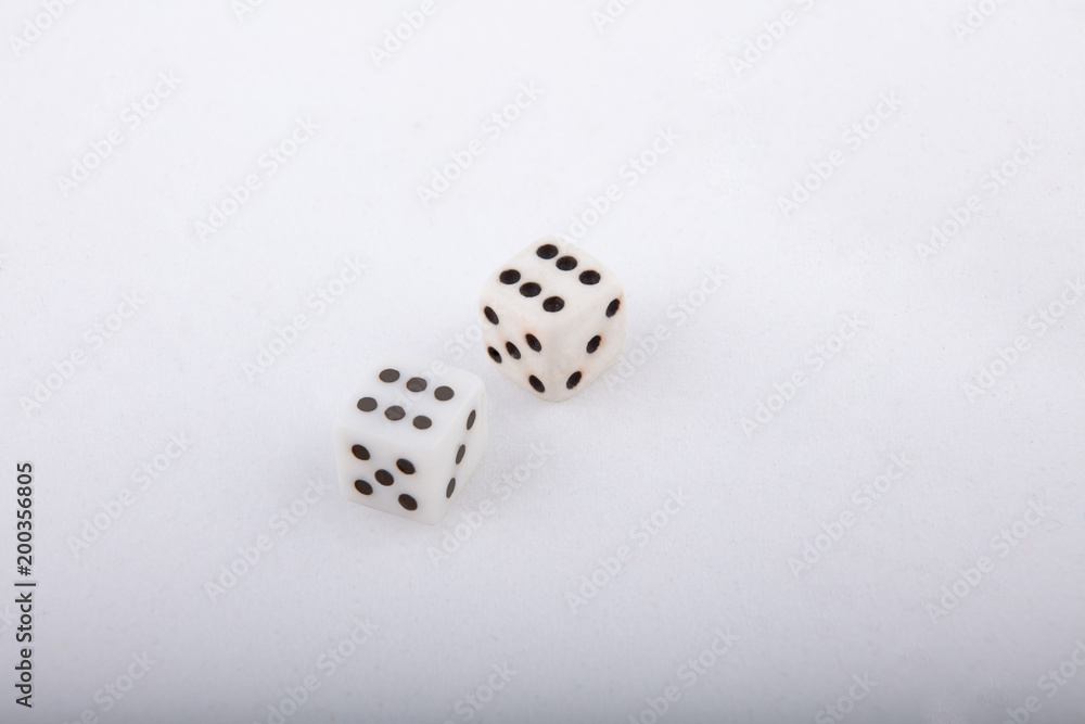 Two old white dice. Isolated on white background. Two old white dice. Isolated on white background.