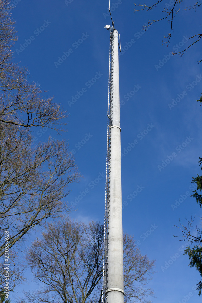 Transmitter mast in front of a blue sky