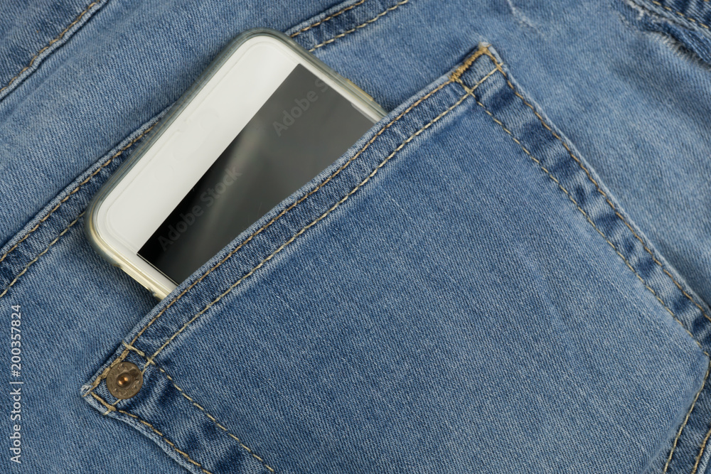 Cell phone in a jeans pocket