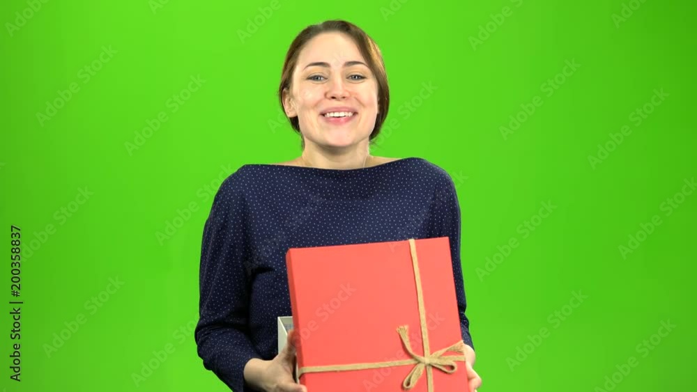Girl is pleased with the gift. Green screen Girl is pleased with the gift. Green screen