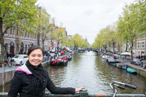 Photography Asian people post with Amsterdam bridge canel