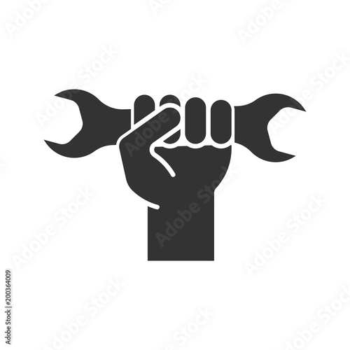 Hand holding wrench glyph icon