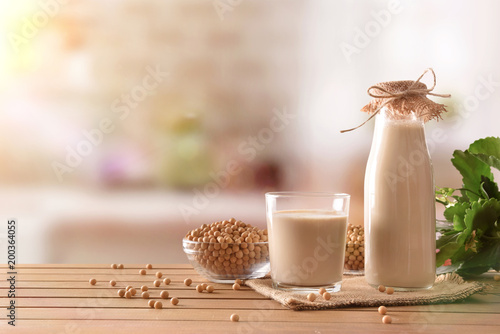Reptientes with soy milk and grains in rustic kitchen background