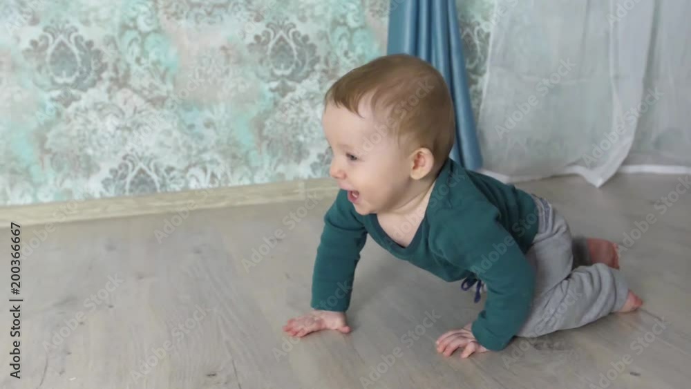 baby boy crawls on the floor, slow motion baby boy crawls on the floor, slow motion