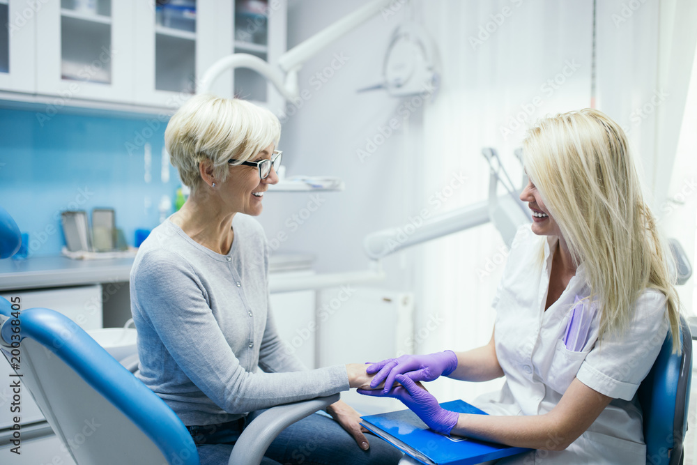 Senior woman having dental treatment at dentist's office. Senior woman having dental treatment at dentist's office.