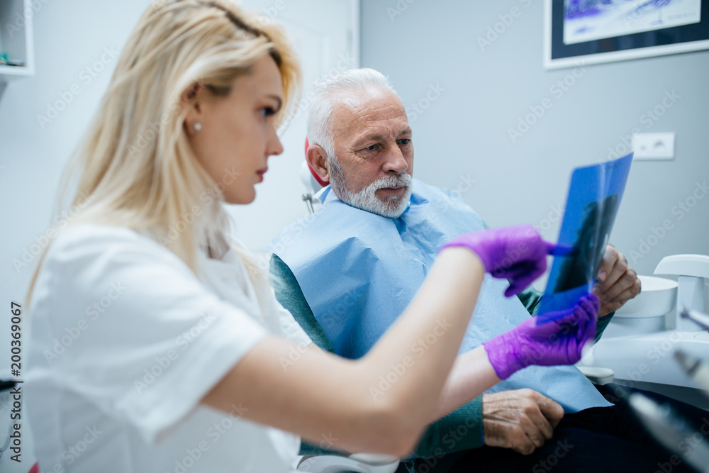 Senior man having dental treatment at dentist's office. Senior man having dental treatment at dentist's office.