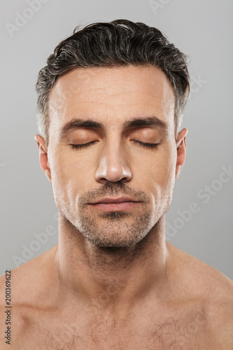 Handsome concentrated mature man. Eyes closed.