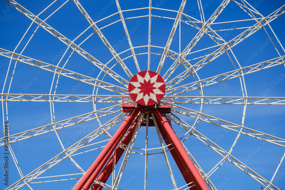 ferris wheel over blue sky ferris wheel over blue sky