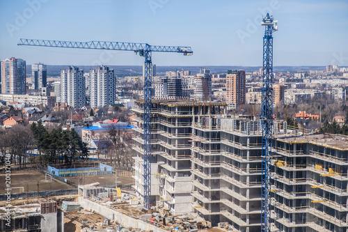 tower cranes against the bl...