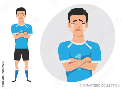 Asian football player crossed his arms and cries. Mans tears and depression. The emotion of disappointment and sadness at the soccer player face. The male was crying