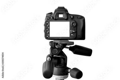 Modern Dslr camera with empty screen on tripod, isolated on white background