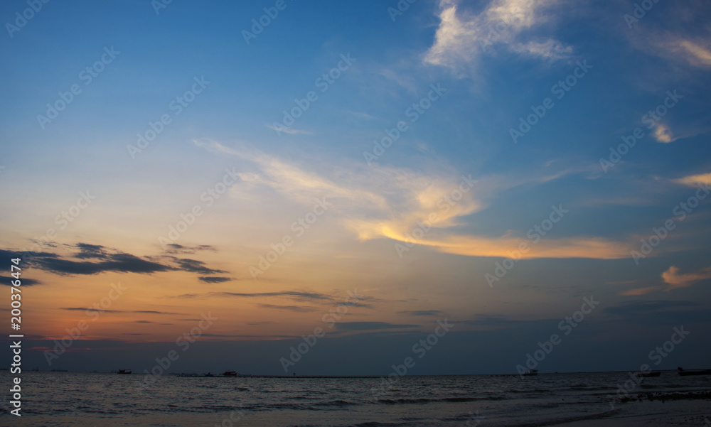 Sunset with soft blue sky background