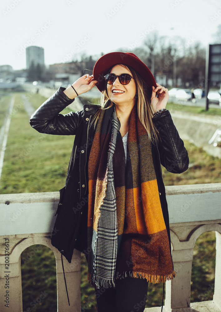 Fototapeta premium Young beautiful woman posing outdoor