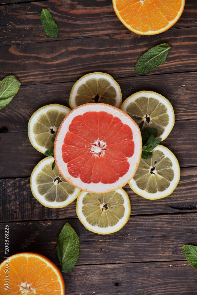 Juicy grapefruit with lemon on a wooden table. Art soft focus and toned. 