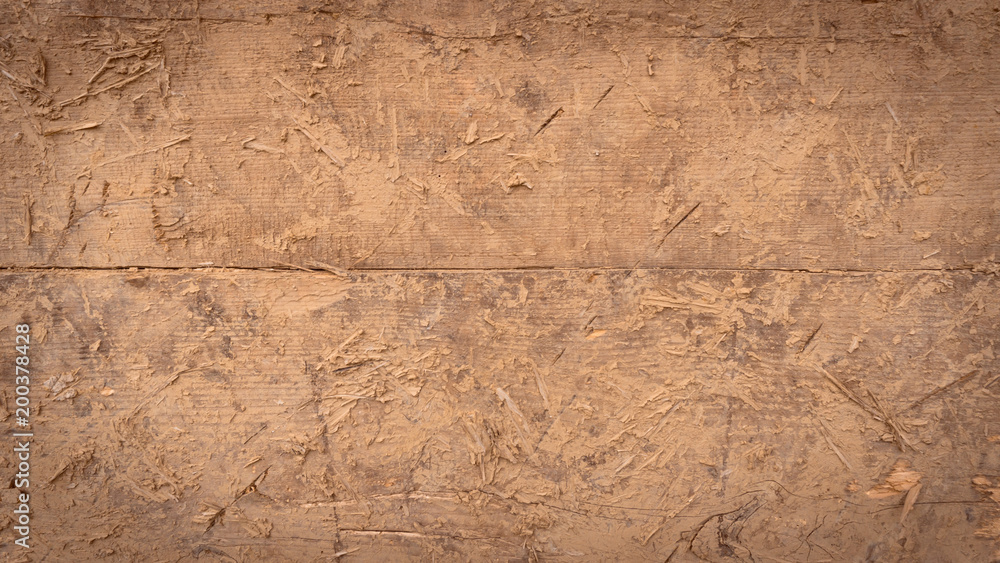 Cracked wall surface of the old wattle and daub house.