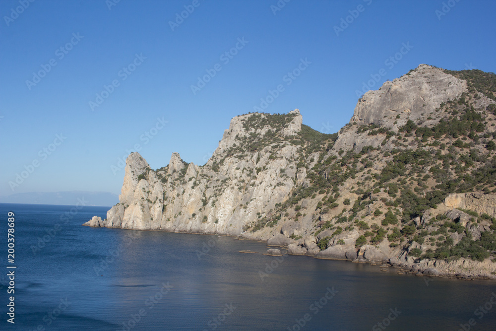 Stunning views of the sea and the mountains on a calm clear day. Stunning views of the sea and the mountains on a calm clear day.