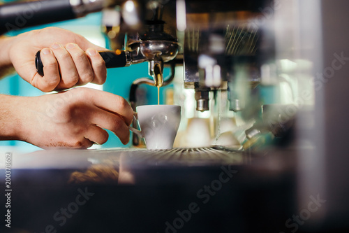 Man Preparing Coffee at Coffee Machine © Volodymyr