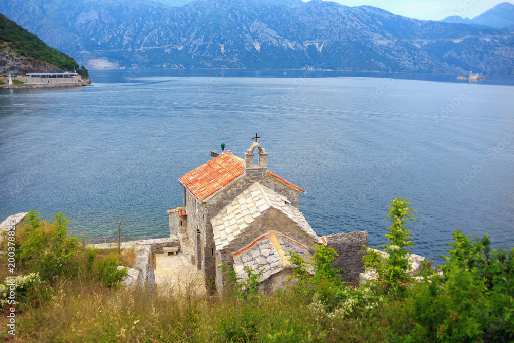 the Church stands on the lake shore