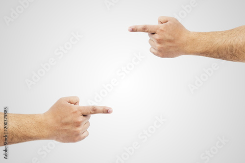Two hands blaming and pointing at each other