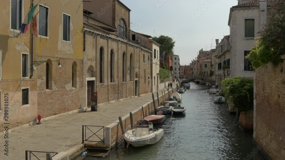 Buildings and moored boats along a canal Buildings and moored boats along a canal