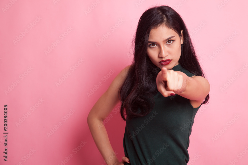 Young Asian woman angry and point to camera. Young Asian woman angry and point to camera.