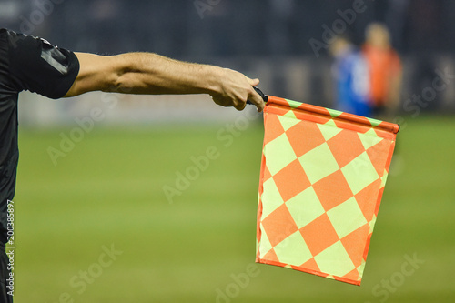 Raised flag of the assistant football referee