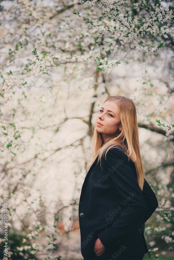 A pretty young girl walking in the park